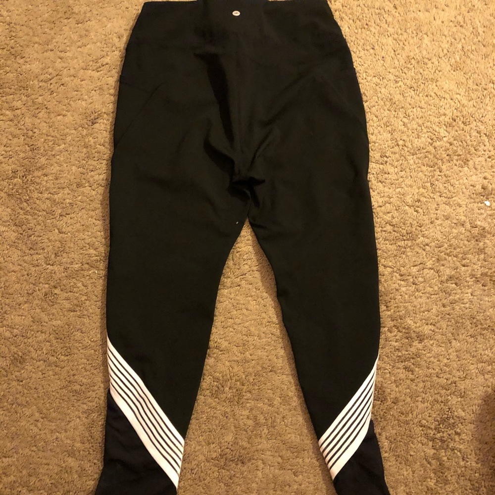 Black leggings w/ white stripes